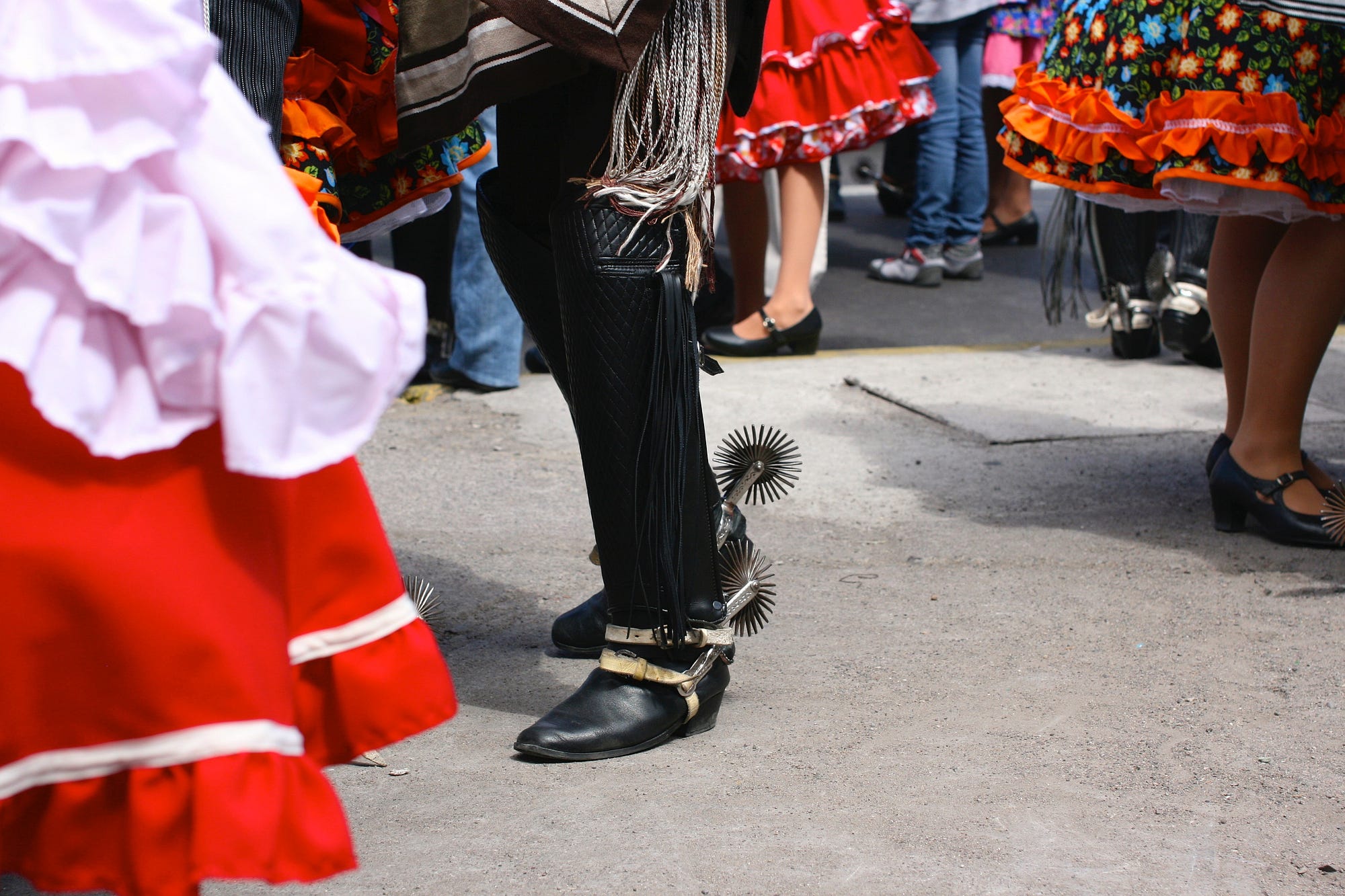 Cowboy boots, spurs and brightly coloured dresses