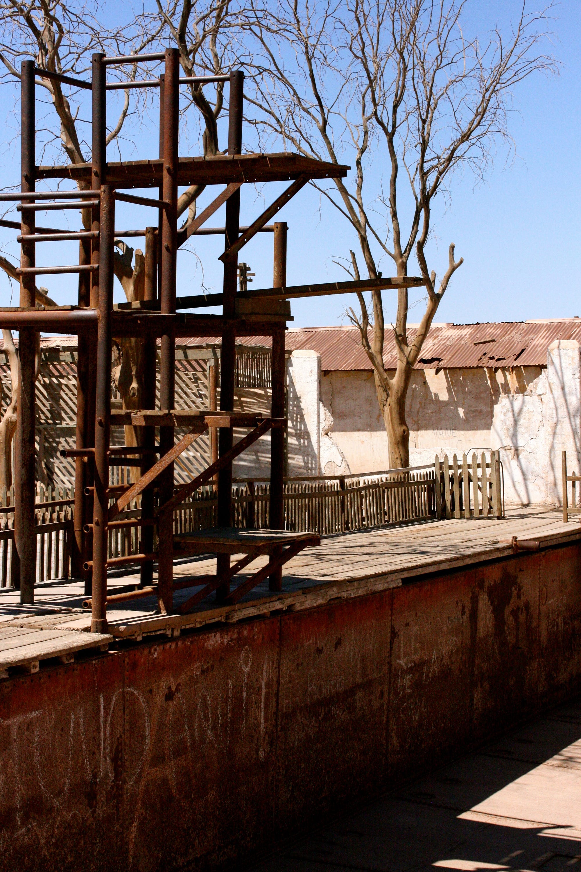 The swimming pool, an icon of leisure and fun, now sits empty and rusted