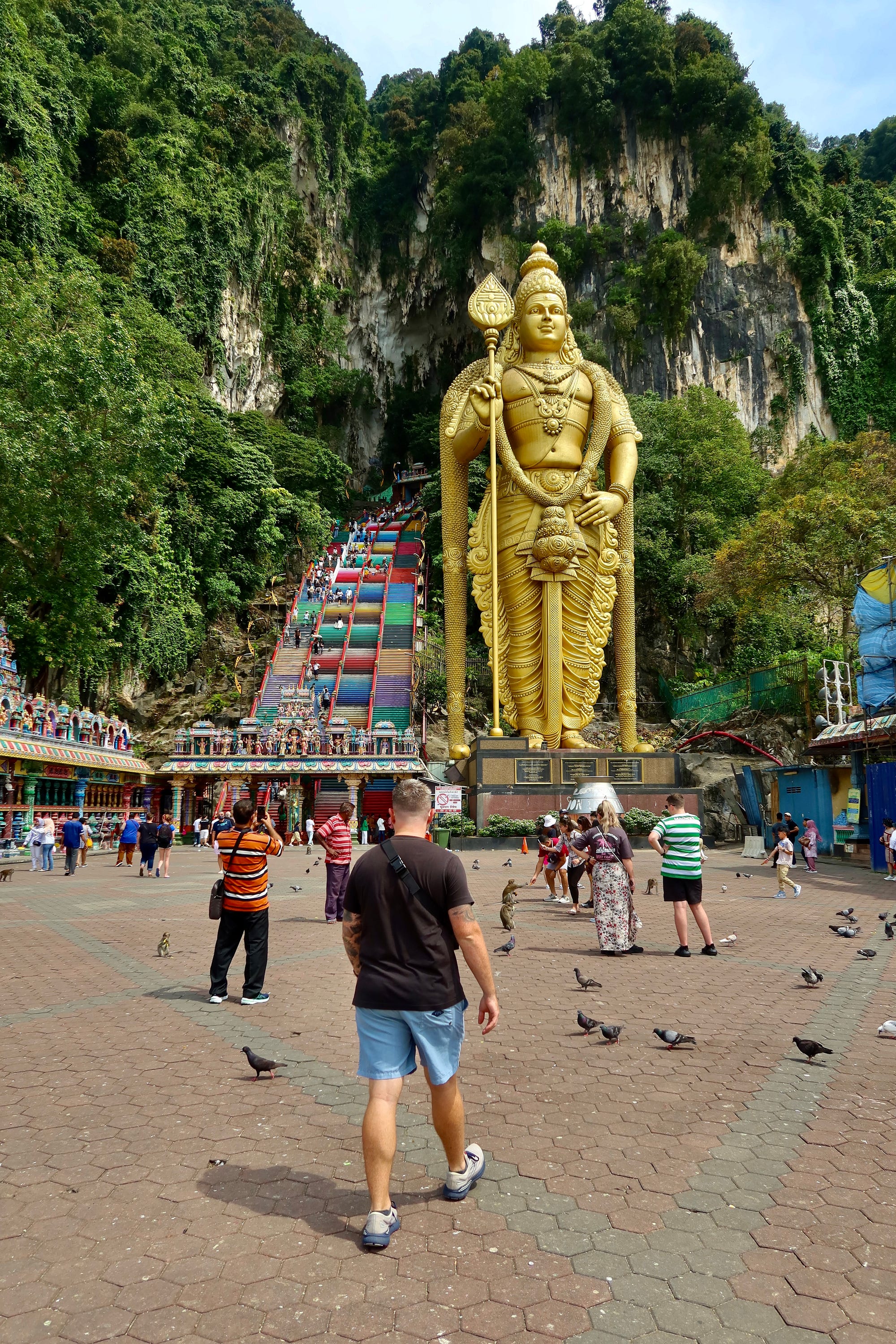 Twenty minutes outside of Kuala Lumpur are the Batu Caves. Imagine beautiful Hindu temples set inside the millions of years old limestone caves. In this photo you can see the third tallest statue of a Hindu deity in the world!