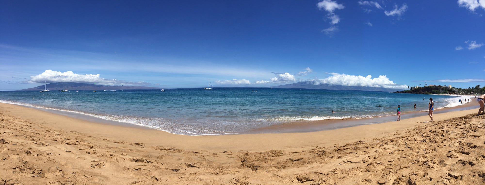 Sunbaking on Ka’anapali Beach with the islands of Lanai and Molokai in the distance