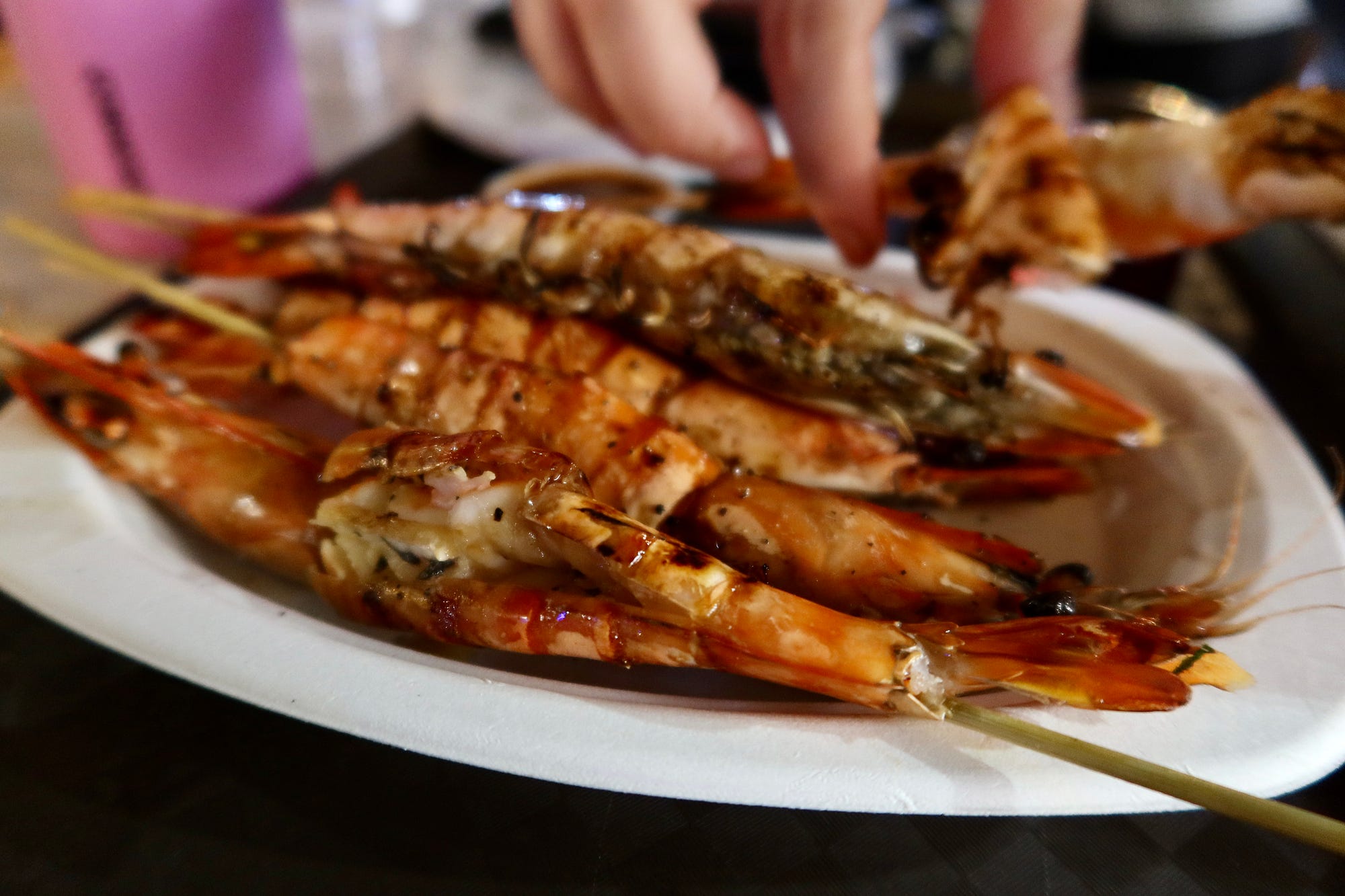 The prawns were enormous, split open and barbecued over hot coals.