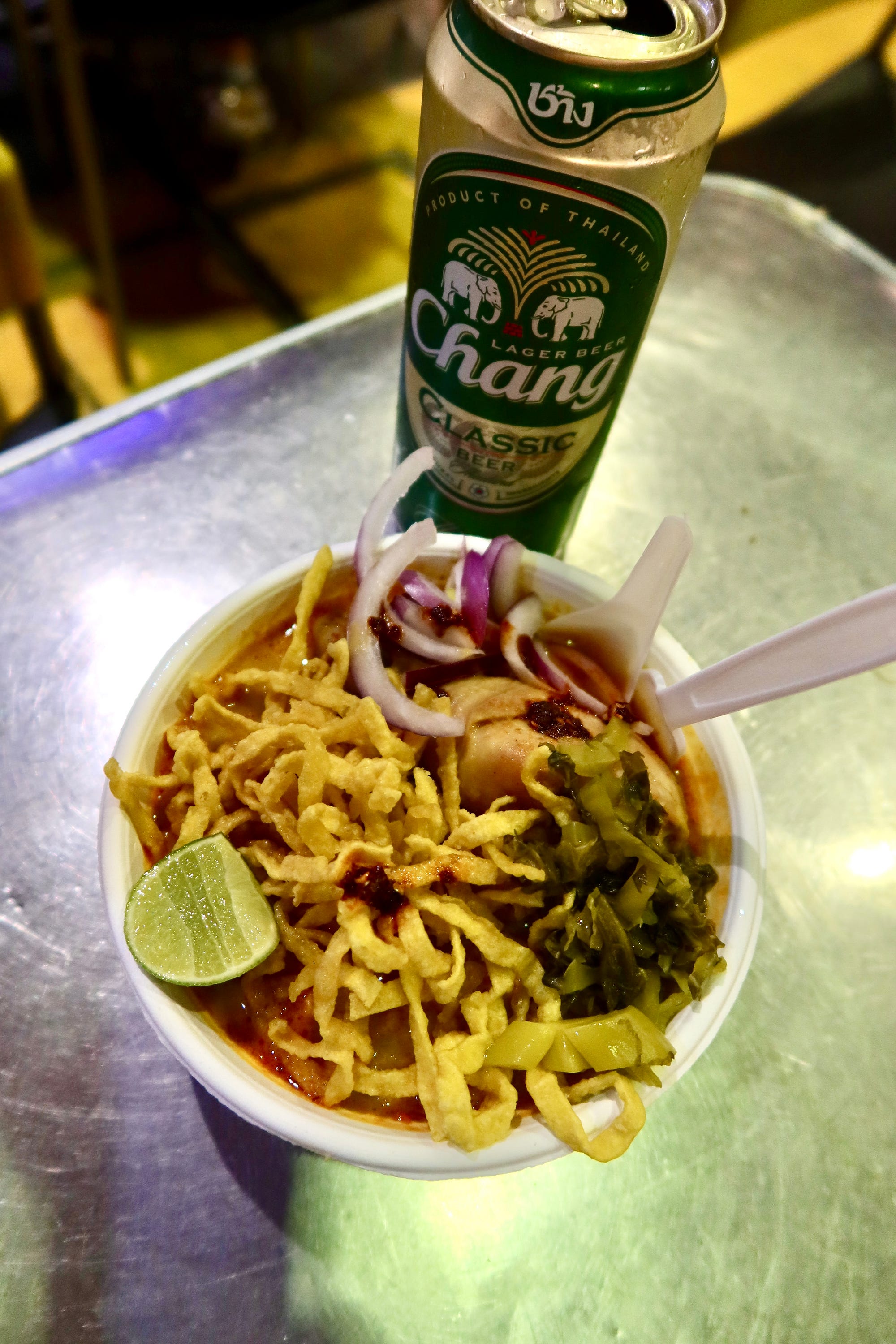 The very popular “khao soi” — a delicious creamy, mild Burmese influenced egg noodle soup often served with slow cooked chicken leg and crunchy flat noodles