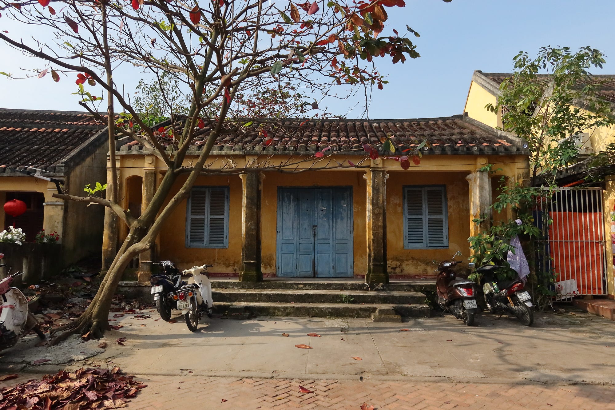 Yellow walled, mossy roofed wooden dwellings from as early as the 17th century line each winding street